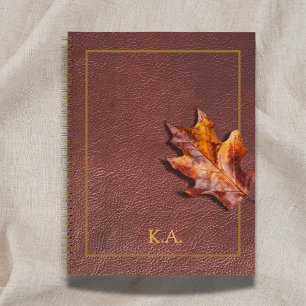 Goldrahmen mit Lederlook und rotem Herbstblatt Notizbuch