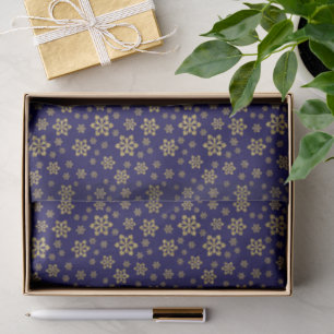 Goldschneeflocken auf dunkelblauem Glitzer Seidenpapier