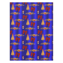 Goldweihnachtliche Dekorationen auf blau Tischdecke