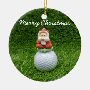 Golf Ball Santa Claus ist auf grünem Gras Weihnach Keramik Ornament