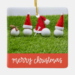 Golf Weihnachtsgeschenke mit Ball und Tee auf grün Keramikornament
