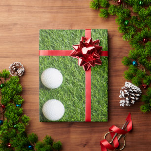 Golfball auf grünem Gras Geschenkpapier