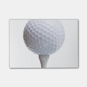 Golfball auf weißer post-it klebezettel