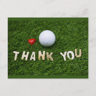 Golfball mit Dankeschön Wort auf grünem Gras Postkarte