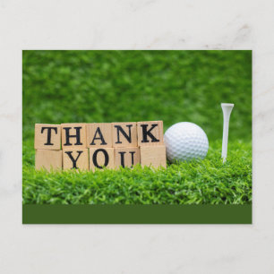 Golfball mit dem Wort Danke auf grünem Gras Postkarte