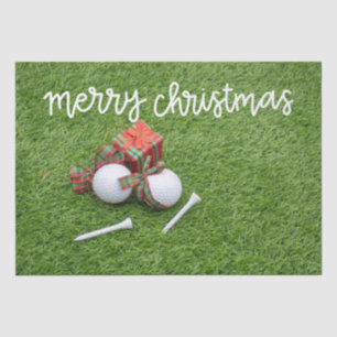 Golfball mit Geschenken auf grünem Weihnachten Seidenpapier