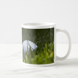 Golfball versteckt kaffeetasse