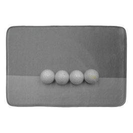 Golfbälle auf grauem Grund Badematte