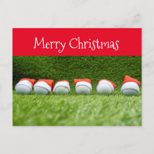 Golfurlaub mit Weihnachtsmannmütze auf Grün Feiertagspostkarte