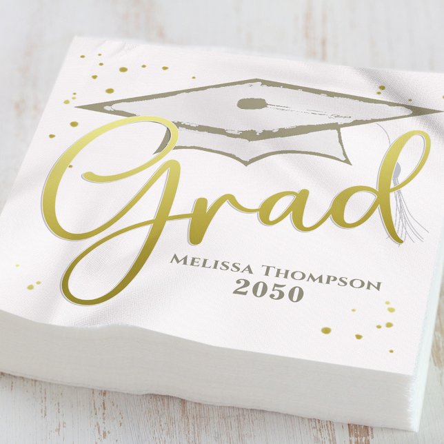 Graduate Grad Gold Calligrafy Graduation Cap Serviette (Gold graduation cocktail napkins displayed beside drinks at a black and gold party table)