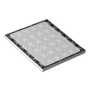 Grafikmuster für den weißen Schädel und die Kreuzb Notizblock