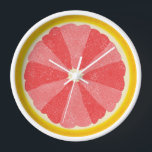 Grapefruit Slice Pop Art Minimalistische Küche Küc Wanduhr<br><div class="desc">Diese farbenfrohe Grapefruituhr ist perfekt für Ihre Küche oder das Frühstück im nook Dekor. Es zeigt ein aufgeschnittenes, offenes Bild einer Grapefruitfruitfrüchte-Hälfte mit 12 Scheiben in abwechselnden Rosatönen, sodass Sie Zeit ohne Zahlen erzählen können. Dieses ungewöhnliche Design hat einen strukturierten Look - und eine Art 60er Pop Kunst / minimalistischer...</div>