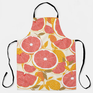 Grapefruit und halbierte Scheiben mit Blätter auf Schürze
