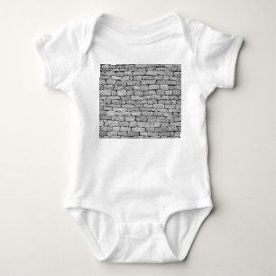 Graue Steinmauer, abstrakter Hintergrund. Baby Strampler