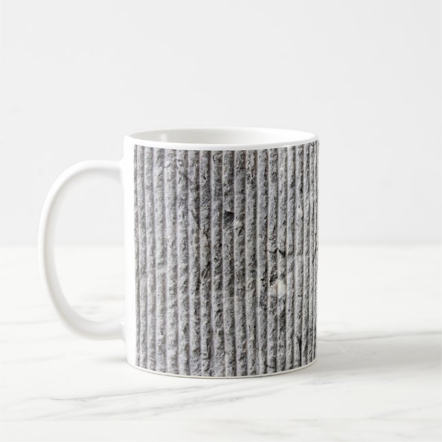 Grausteinfarbene Wandstruktur. Textur der Steinmau Kaffeetasse (Links)