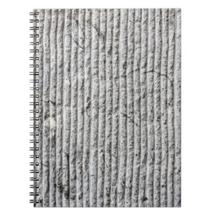 Grausteinfarbene Wandstruktur. Textur der Steinmau Notizblock