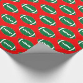 Green Footballs auf Red Background Weihnachtsgesch Geschenkpapier