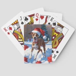 Greyhound läuft im Schnee mit Weihnachtshut Spielkarten