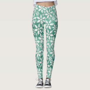 Große weiße Schneeflocken fallen ins Grüne Leggings