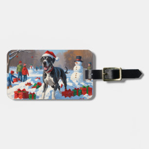 Großes Dane läuft im Schnee mit Weihnachtshut Gepäckanhänger