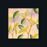 Grün und Gelb Blätter im Hintergrund Leinwanddruck<br><div class="desc">Der lila und goldene Hintergrund eines Sonnenuntergangs bildet den perfekten Kontrast zu den gelben und grünen Blätter,  auf die Megan Meagher sich in diesem Werk konzentriert. Man kann fast den Wind singen hören,  wenn er die Blätter sanft umhüllt.</div>