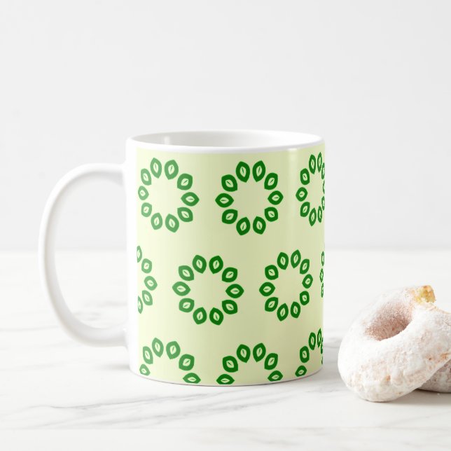 Grüne Blätter in einem gelben Kreis Kaffeetasse (Mit Donut)