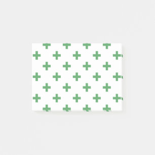 Grüne Polka kreuzt auf Weiß Post-it Klebezettel