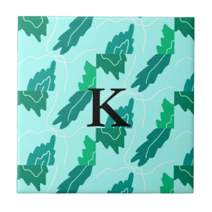 Grüne Türkis-Blatt-Blumenmuster fügen Monogramm hi Fliese