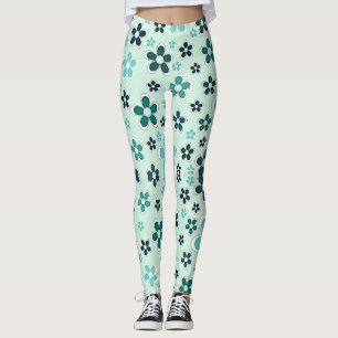 Grüne und blaue Blume auf hellgrünem Hintergrund Leggings