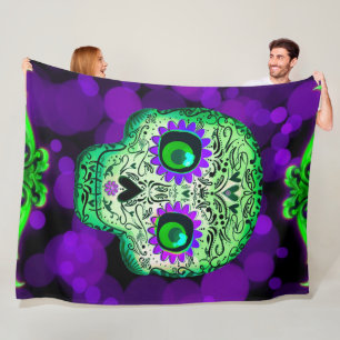Grüne und violette leuchtende Zuckerschädel Hallow Fleecedecke