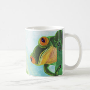 Grüner Frosch, der Rochen fängt Kaffeetasse