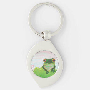 Grüner Frosch hinter dem Schlüsselanhänger des Lil