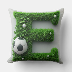 Grüner Gras-Buchstabe E-Topiarie mit Fußball Kissen