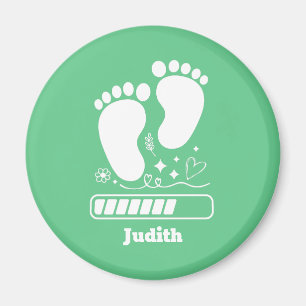 Grünes Baby lädt Magnet