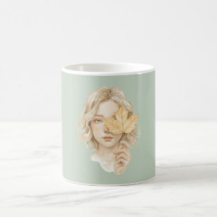 Grünes blondes Mädchen gelbes Blatt fällt Kaffeetasse