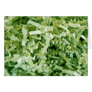 Grünes, zerkleinertes Papier, Foto eingeklemmt, in