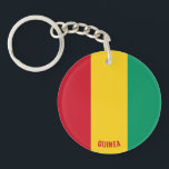 Guinea Charming Patriotic Schlüsselanhänger<br><div class="desc">Guinea Flag Bezaubernder Patriotischer Schlüsselanhänger mit der Guinea Flag gedruckt auf dem ganzen Schlüsselanhänger. Ländername in subtil in das Design am unteren Rand integriert. Der Text kann mit der Funktion "Anpassen!" vollständig angepasst werden. Dieser wunderschöne Schlüsselanhänger der Guinea ist das stilvolle Geschenk für jeden Anlass. © CountriesOfTheWorld</div>