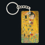 Gustav Klimt Der Kiss Schlüsselanhänger<br><div class="desc">Schlüsselanhänger mit Gustav Klimts Ölgemälde mit Goldblatt Der Kuss (1908). Ein Mann und eine Frau,  die leuchtende goldene Farben tragen,  sich liebevoll umarmen und in einem Feld von Blume küssen. Ein großartiges Geschenk für Jugendliche und österreichische Kunstliebhaber.</div>