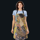 Gustav Klimt-Lady mit einem Fan | Schürze<br><div class="desc">[Besondere Erinnerung] Dieses Produkt wurde unter Verwendung eines hochauflösenden JPG-Formats mit den Abmessungen 11088 x 11040 Pixel bei 300 DPI entwickelt.** Gustav Klimts "Lady with a Fan" ist ein faszinierendes Porträt, das den Kern der Jugendstil- und Jugendstil-Bewegungen erahnen lässt. Das Gemälde zeigt eine Regalfrau, ihren Blick direkt und selbstbewusst, und...</div>