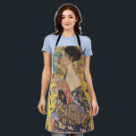 Gustav Klimt-Lady mit einem Fan | Schürze<br><div class="desc">[Besondere Erinnerung] Dieses Produkt wurde unter Verwendung eines hochauflösenden JPG-Formats mit den Abmessungen 11088 x 11040 Pixel bei 300 DPI entwickelt.** Gustav Klimts "Lady with a Fan" ist ein faszinierendes Porträt, das den Kern der Jugendstil- und Jugendstil-Bewegungen erahnen lässt. Das Gemälde zeigt eine Regalfrau, ihren Blick direkt und selbstbewusst, und...</div>