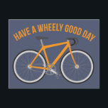 Haben Sie ein wenig guten Tag Fahrrad Postkarte<br><div class="desc">Mit dieser Postkarte können Sie Ihren Lieblings-Radfahrer oder Radfahrer begrüßen. Es zeigt das lustige Spiel auf der Wortmeldung "Have a Wheely Good Day" in orange über einem passenden orangefarbenen Fahrrad vor einem schieferblauen Hintergrund. Der leere Rücken ist bereit für Sie,  Ihre eigene personalisierte Nachricht hinzuzufügen.</div>