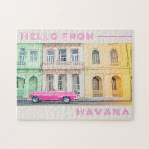 Hallo aus dem Retro-Rosa-Auto und der Architektur Puzzle