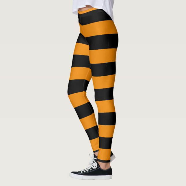 Halloween-Art-orange und schwarzes gestreiftes Leggings (Links)