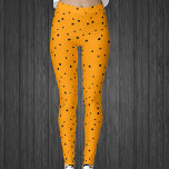 Halloween Farben schwarze Sterne auf hellen Orange Leggings<br><div class="desc">Die Leggings dieser Frau sind zu Halloween,  mit einem himmlischen Motiv,  das mit kleinen schwarzen Sternen auf hellen Orangen bedeckt ist.</div>