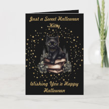 Halloween-Katze mit falschen Goldsternen und Büche