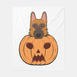 Halloween-Niedliche deutsche Hirten stecken in ein Fleecedecke