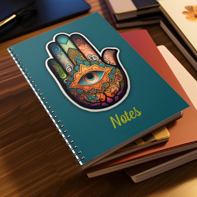 Hamsa Hand Spiral Notebook Notizblock (A pile of notebooks lies on a desk)