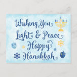 Hanukkah Licht und Frieden Feiertagspostkarte<br><div class="desc">Eine jüdische Hanukkah-Theme-Karte mit einer Menorah, Stern von David und Driedel. Der Text lautet "Wishing You Light & Peace Happy Hanukkah. Der Hintergrund ist eine hellblaue Aquarellwäsche. Personalisieren Sie den Rücken mit Ihrer eigenen Nachricht und/oder Ihrem Firmenlogo. Diese Postkarten sind eine kostengünstige Möglichkeit, Ihre Feiertagsgrüße zu senden, ohne die Bank...</div>