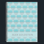 Hanukkah Menorah Blue Personalisiert Kids Name Notizbuch<br><div class="desc">Dieses festliche Notizbuch zeichnet sich durch ein sich wiederholendes Menorah-Muster in hellblau und grau auf einem weichen himmelblauen Hintergrund aus, ideal um den Geist von Hanukkah zu feiern. Die Vorderseite bietet Platz für einen individuelle Name in sauberer, moderner Typografie. Ideal als Urlaubsgeschenk für Kinder, Schüler und Lieben, die während der...</div>