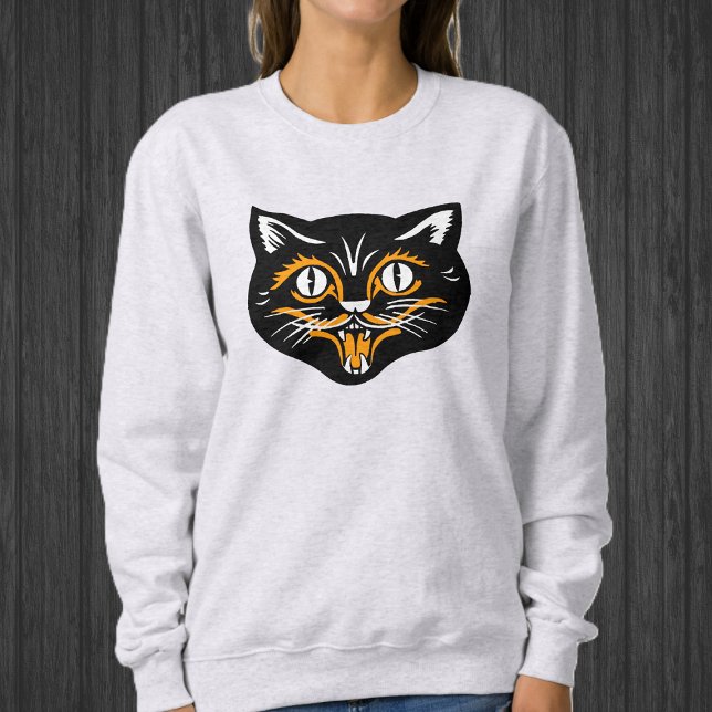 Happy Halloween Black Cat Face mit Orange White Sweatshirt (Happy Black cat face for Halloween with orange and white accents on sweatshirt.)